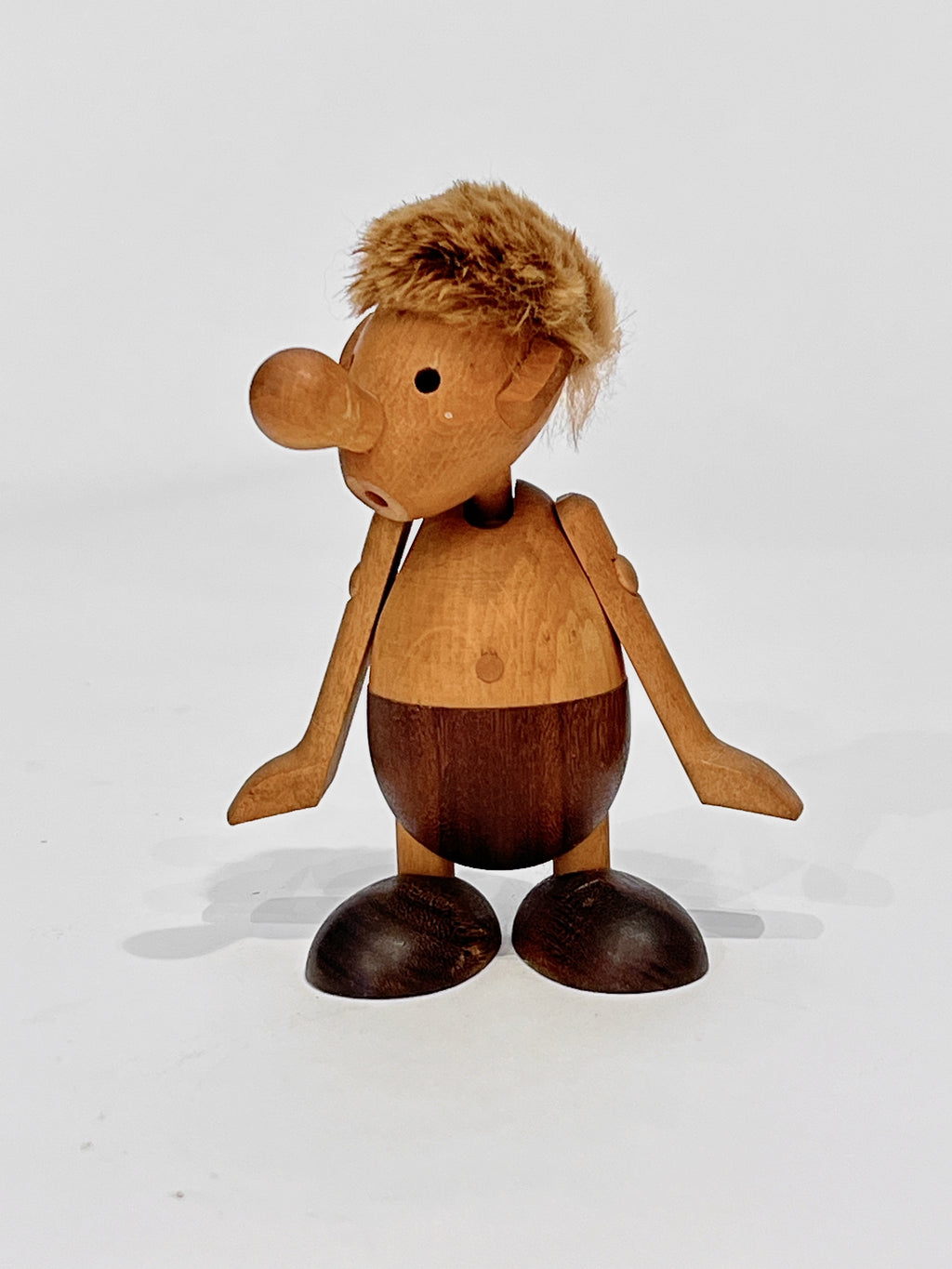 Wooden toy figure with a white background