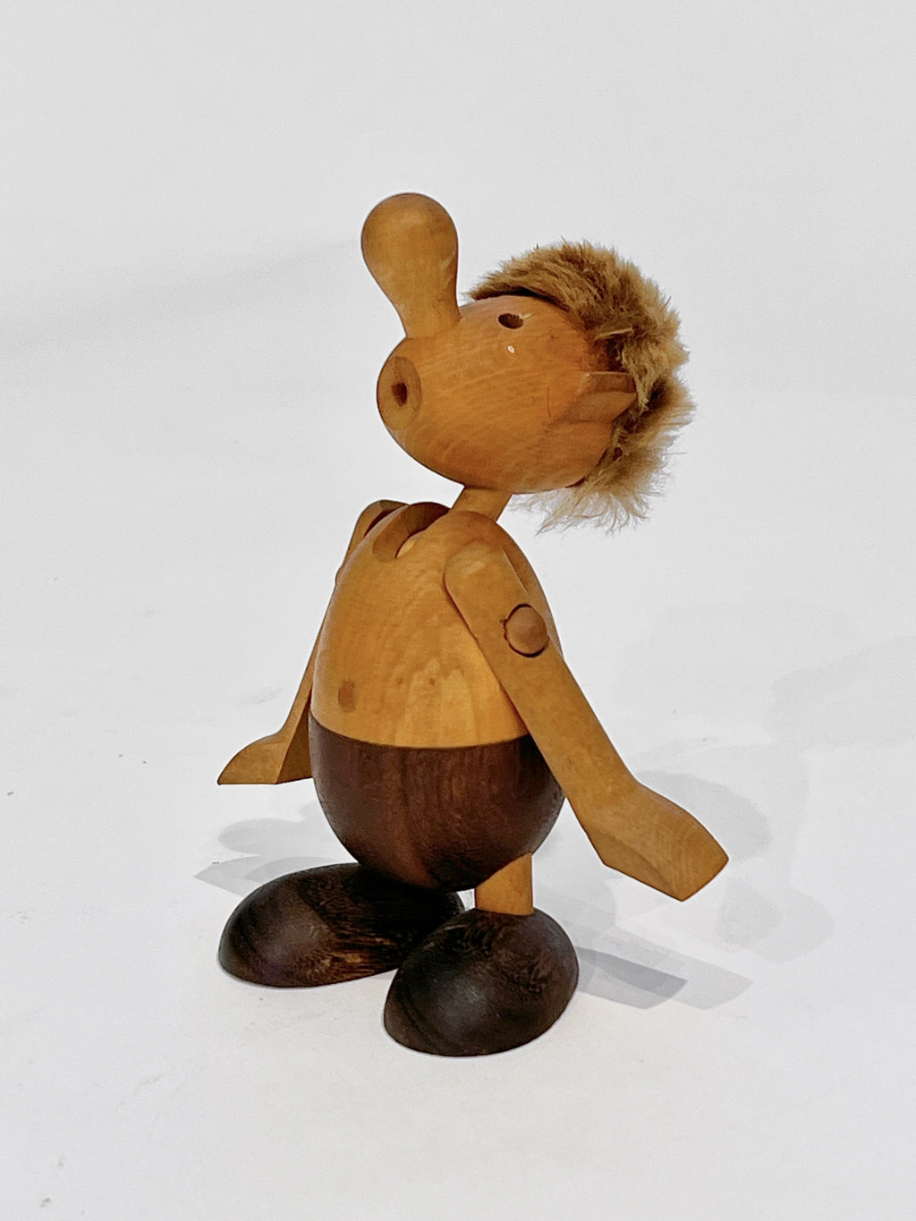 Wooden figurine with a white background
