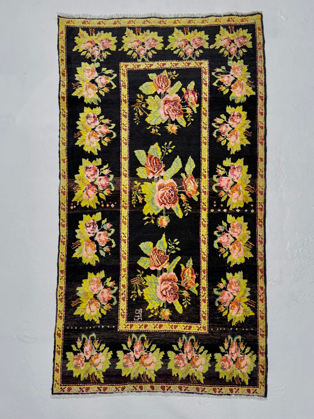 Decorative rug with floral patterns on a black background