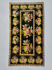 Decorative rug with floral patterns on a black background