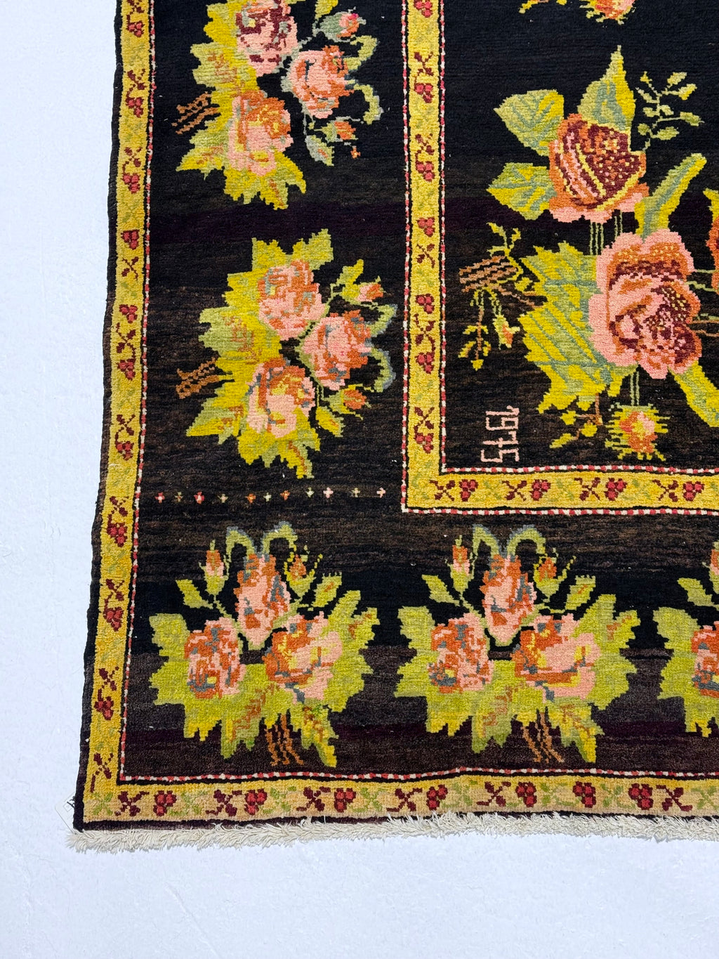 Decorative rug with floral patterns on a black background