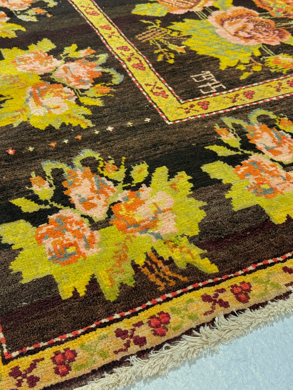 Close-up of a floral patterned rug with intricate designs.