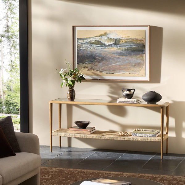 Modern living room with a console table, sofa, and decorative items.