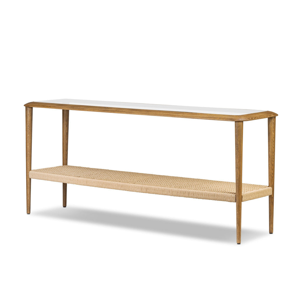 Console table with a white top and woven shelf on a white background
