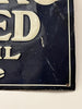 Corner of a vintage sign with worn and scratched surface