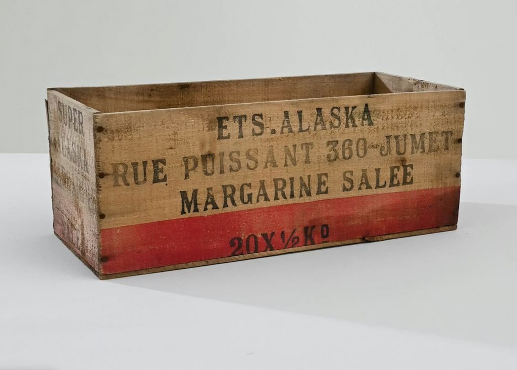 Vintage wooden crate with stamped text on a white background