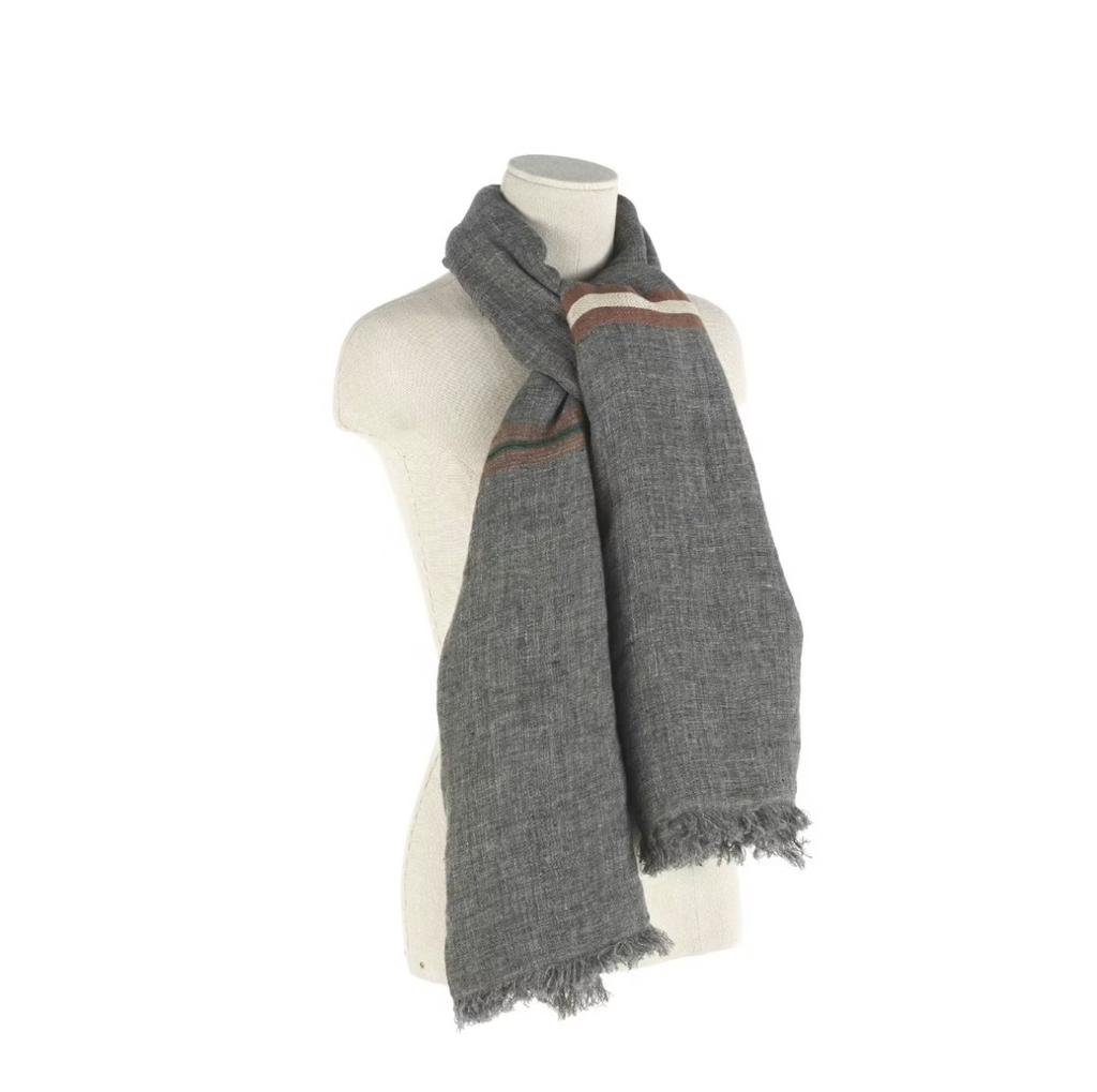 Gray scarf with a striped pattern draped over a mannequin on a white background
