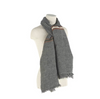 Gray scarf with a striped pattern draped over a mannequin on a white background