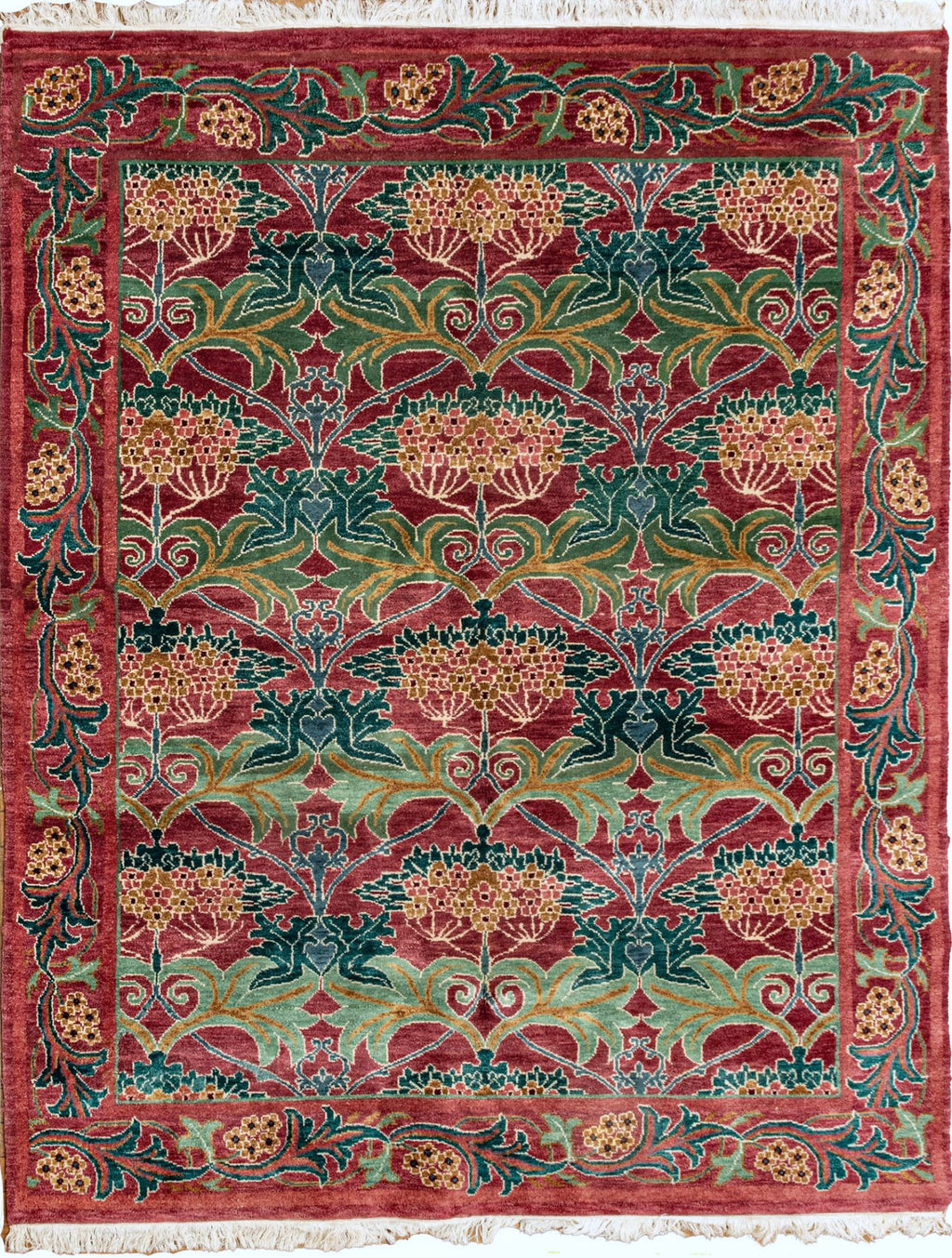 Decorative rug with intricate patterns in red, green, and gold on a white background. in an art deco in the style of William Morris