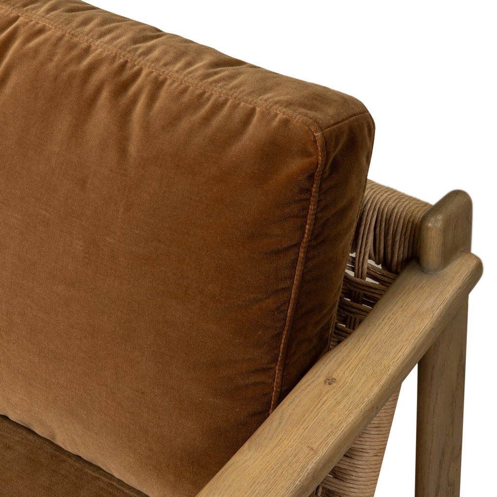 Brown cushion on a wooden chair with a white background