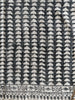 Textile with a geometric pattern on a black background