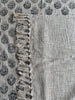 Textured fabric with decorative border and patterned background