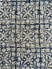 Close-up of a patterned fabric with blue and beige design