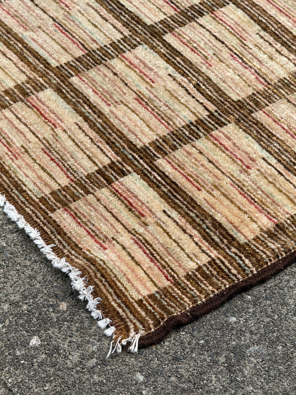 Detail of Plaid patterned rug flat weave gabbeh rug