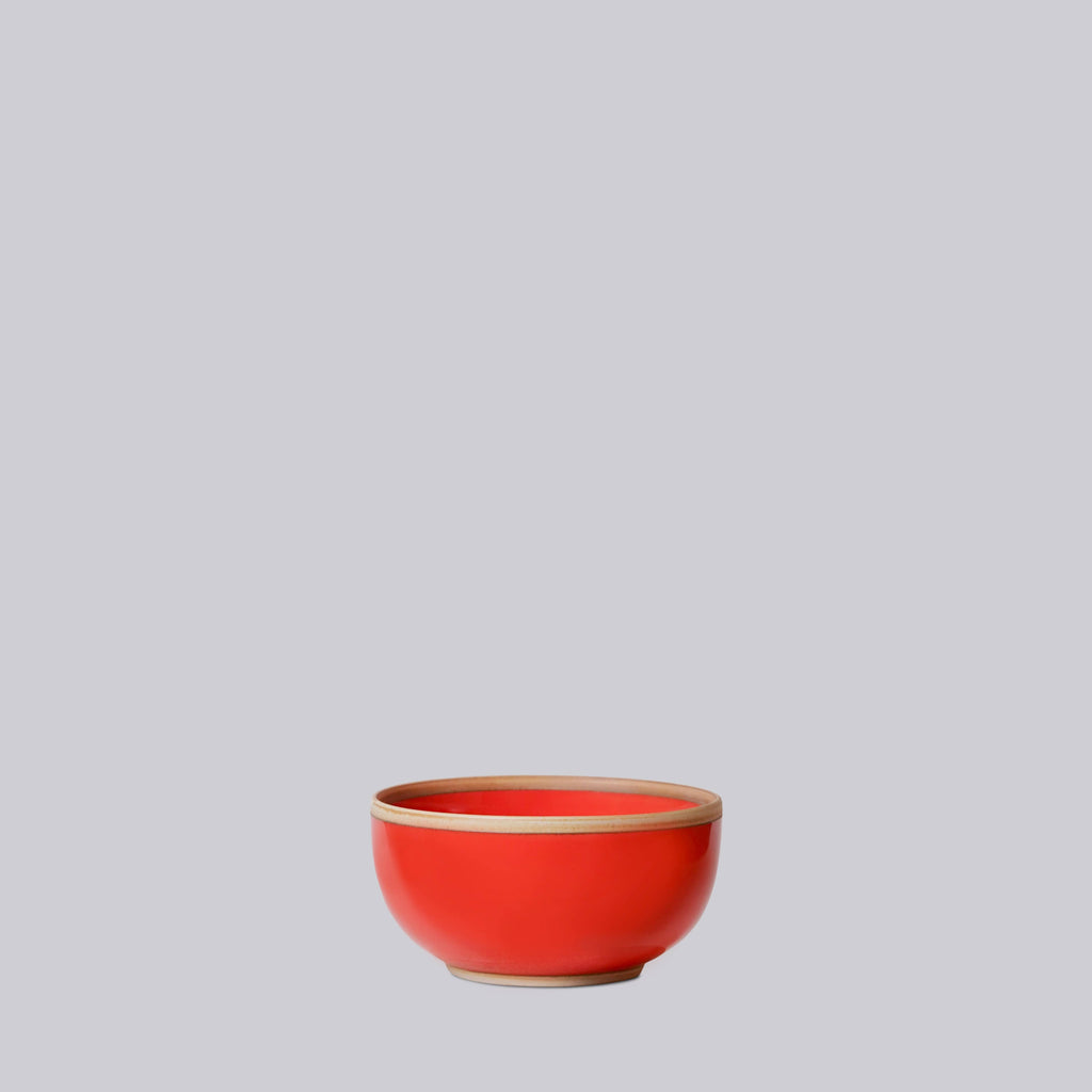 Coral Red ceramic soup bowl on a light gray background