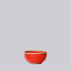 Coral Red ceramic soup bowl on a light gray background
