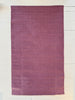 Purple striped rug on a light wooden floor