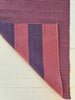Striped fabric with purple and pink pattern on a white background