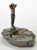 Decorative ashtray with a figurine on a white background