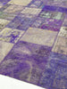 Patchwork rug with purple and gray squares on a white background