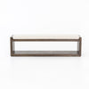 Wooden bench with white cushion on a white background