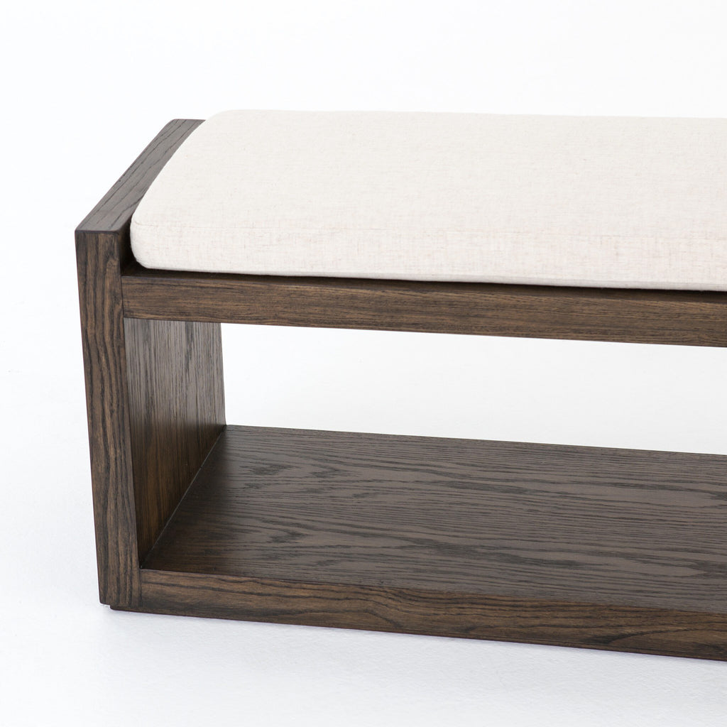 Wooden bench with a white cushion on a white background