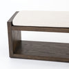 Wooden bench with a white cushion on a white background