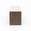 Wooden ottoman with a white cushion on a white background
