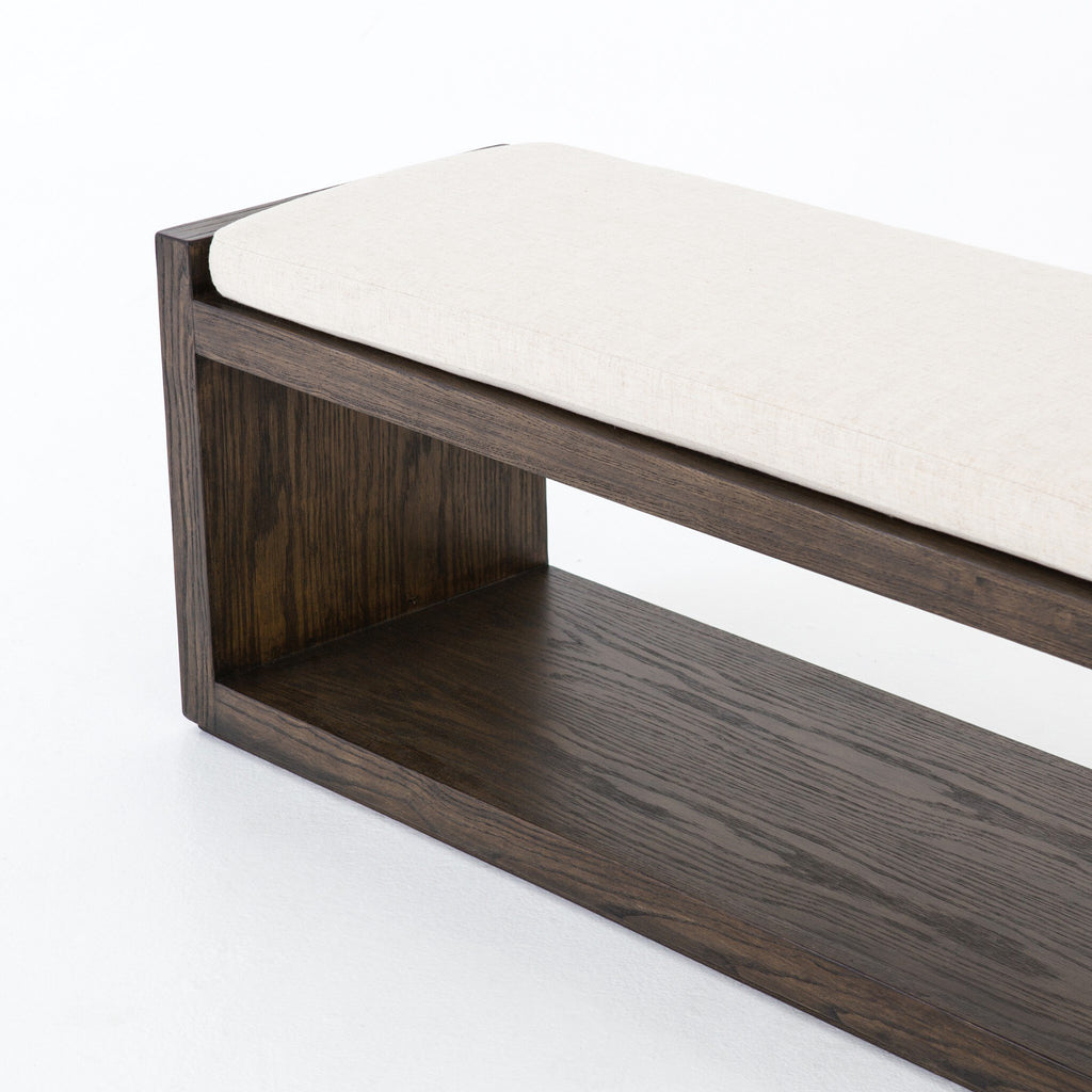 Wooden bench with a white cushion on a white background