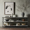 Shelving unit with decorative items against a gray wall