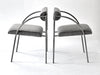 Two modern chairs with gray cushions on a white background