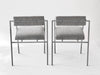Two modern stools with gray seats and backs on a white background