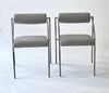 Two gray chairs with metal frames on a white background