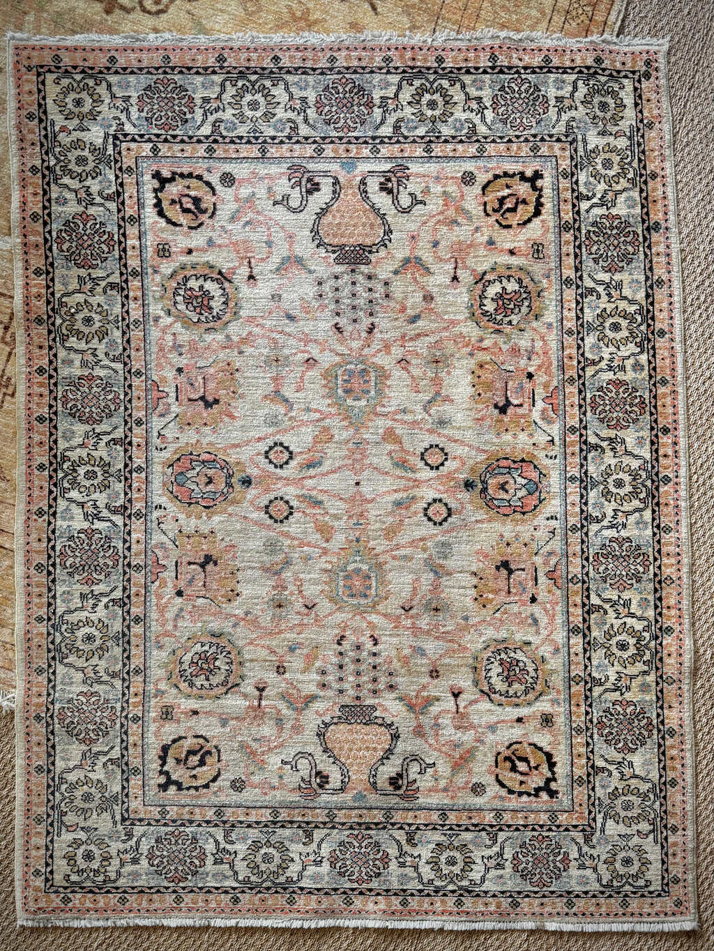 Decorative rug with intricate patterns on a textured surface