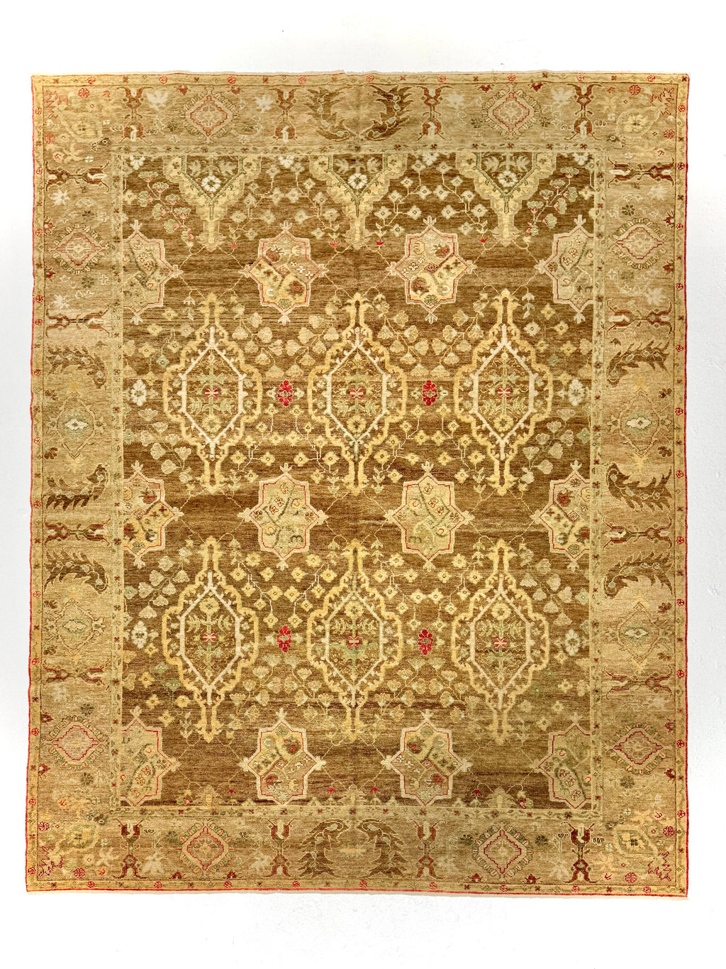 Decorative rug with intricate pattern on a white background