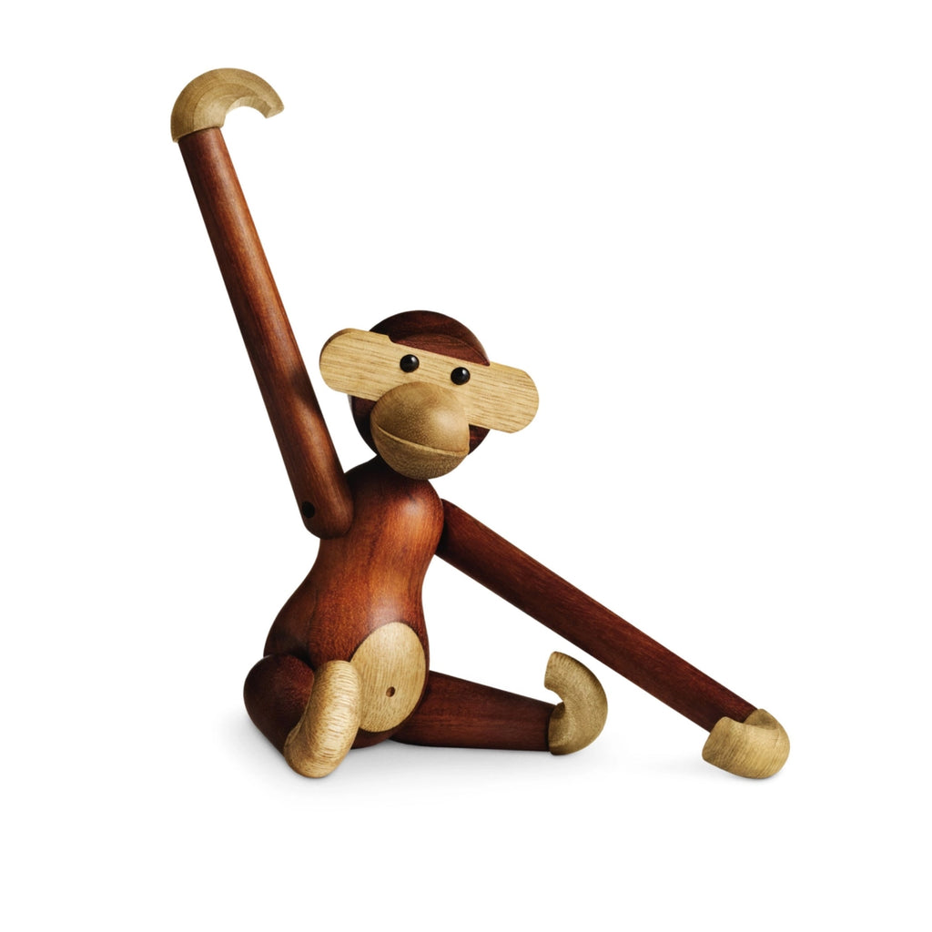 Wooden monkey figurine on a white background