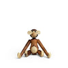 Wooden monkey figurine on a white background