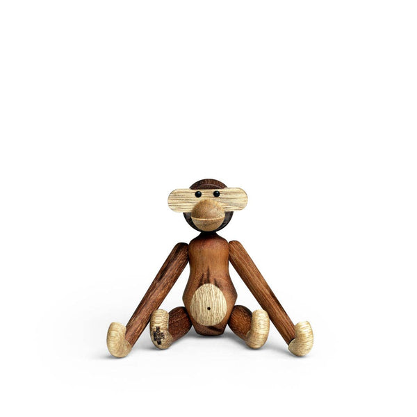 Wooden monkey figurine on a white background