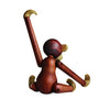 Wooden monkey figurine on a white background