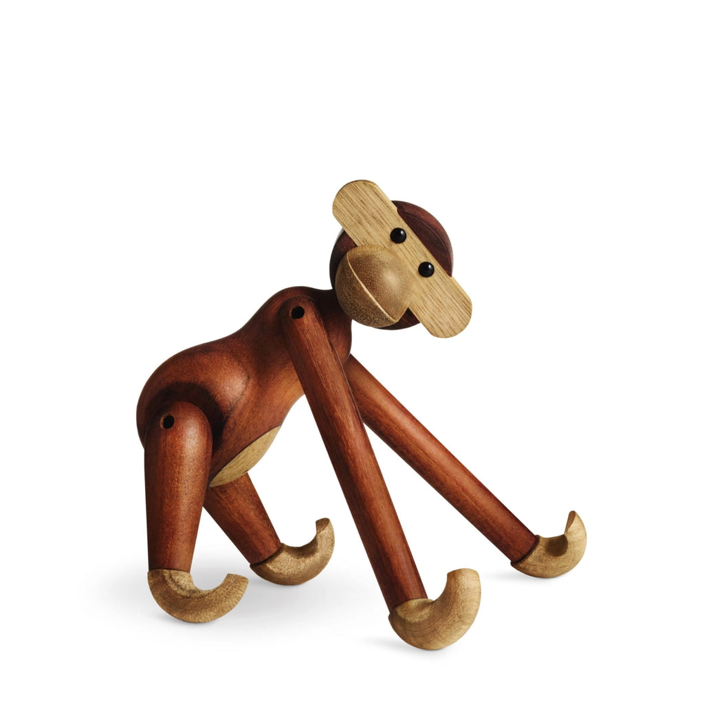 Wooden monkey figurine on a white background
