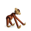 Wooden monkey figurine on a white background