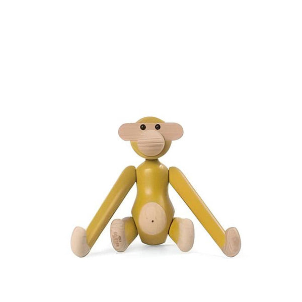 Wooden monkey toy on a white background by Kay Bojesen artist