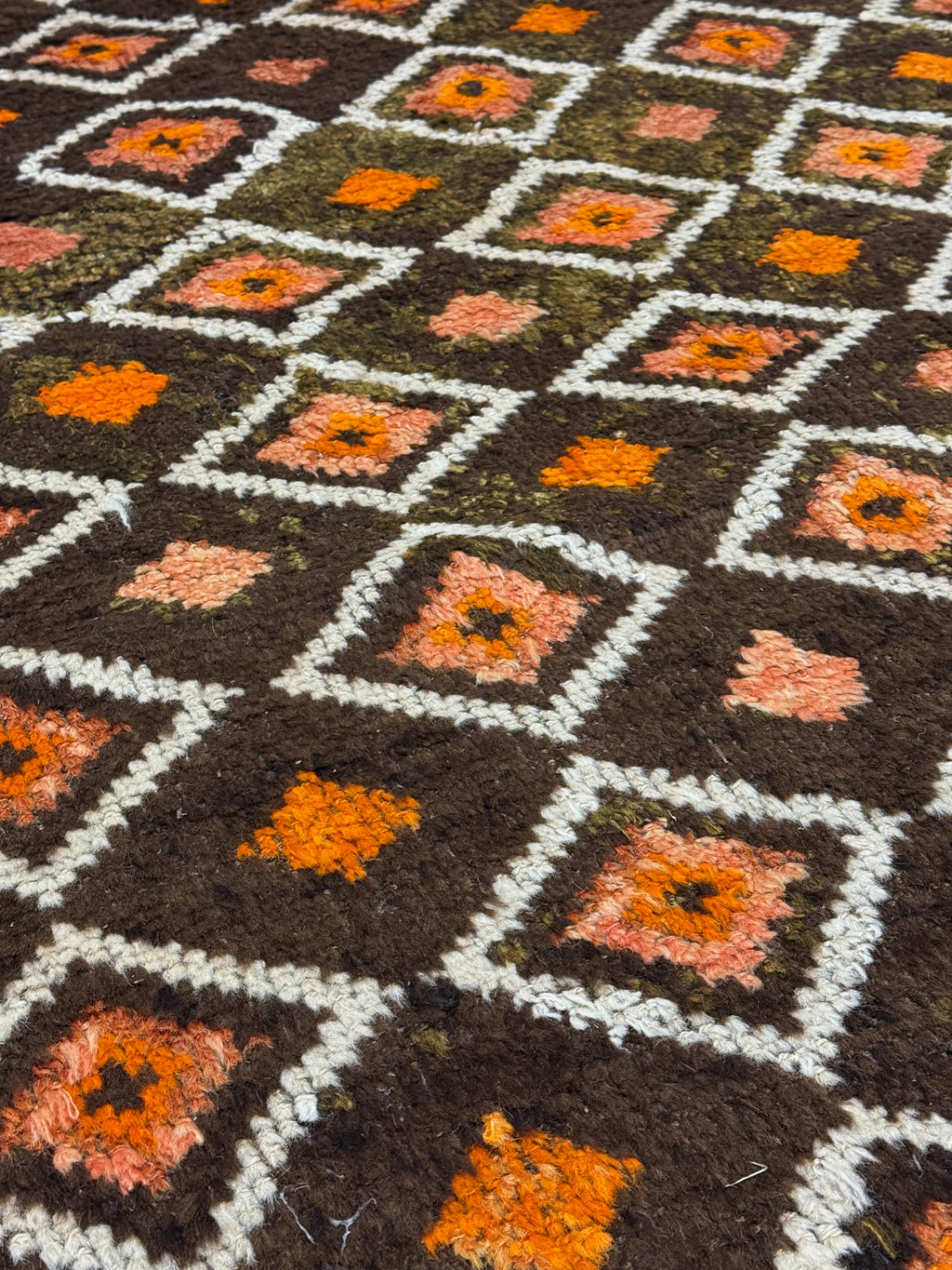 Close-up of a patterned vintage rug with geometric design