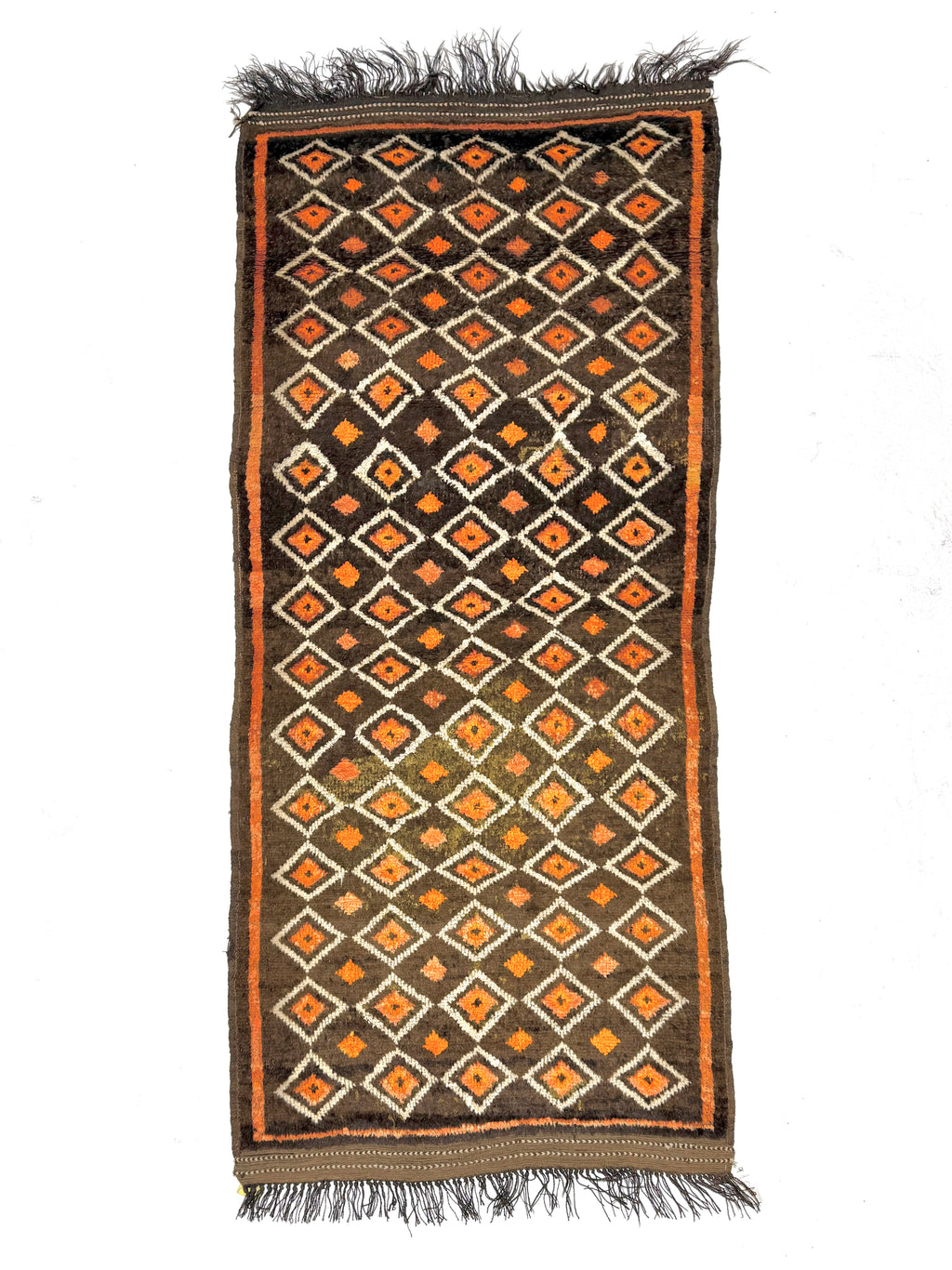 Decorative rug with geometric pattern on a white background