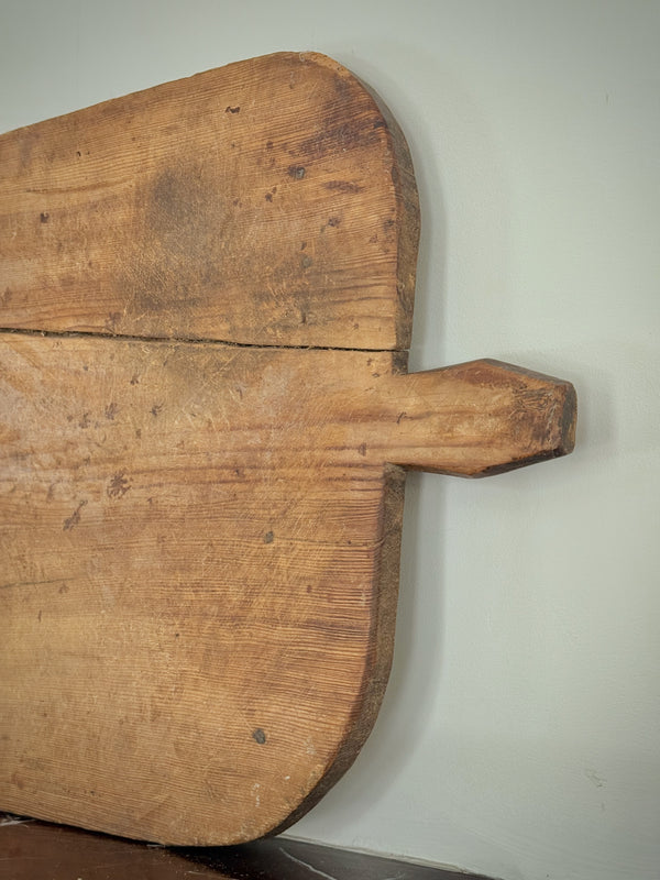 Vintage wooden cutting board with a handle 