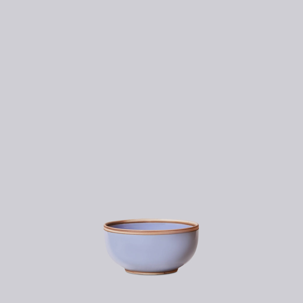 lavender ceramic soup bowl on a light gray background