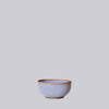 lavender ceramic soup bowl on a light gray background