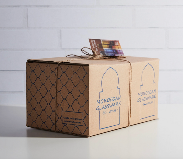 Cardboard box with 'Moroccan Glassware & Culture' branding on a white surface.