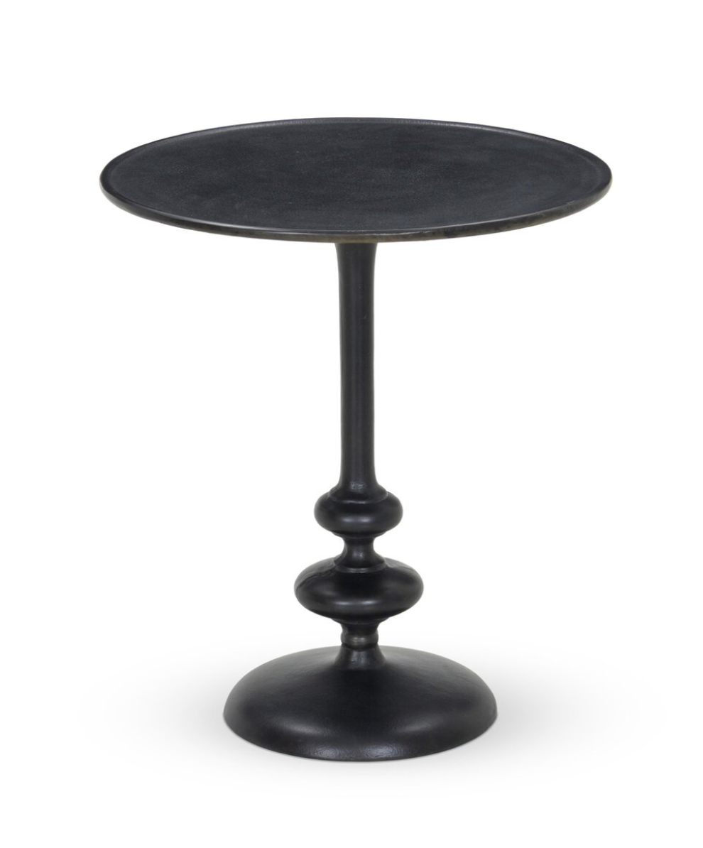 Black side table with a round top and textured base on a white background