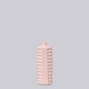 Pink textured bottle on a light gray background